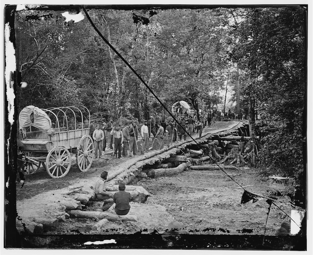 The route of march led across numerous bayous that Union engineers had to bridge with materials at hand, similar to these Union troops from Wisconsin. Gin houses and barns were dismantled to provide the necessary material in the approach to Vicksburg.