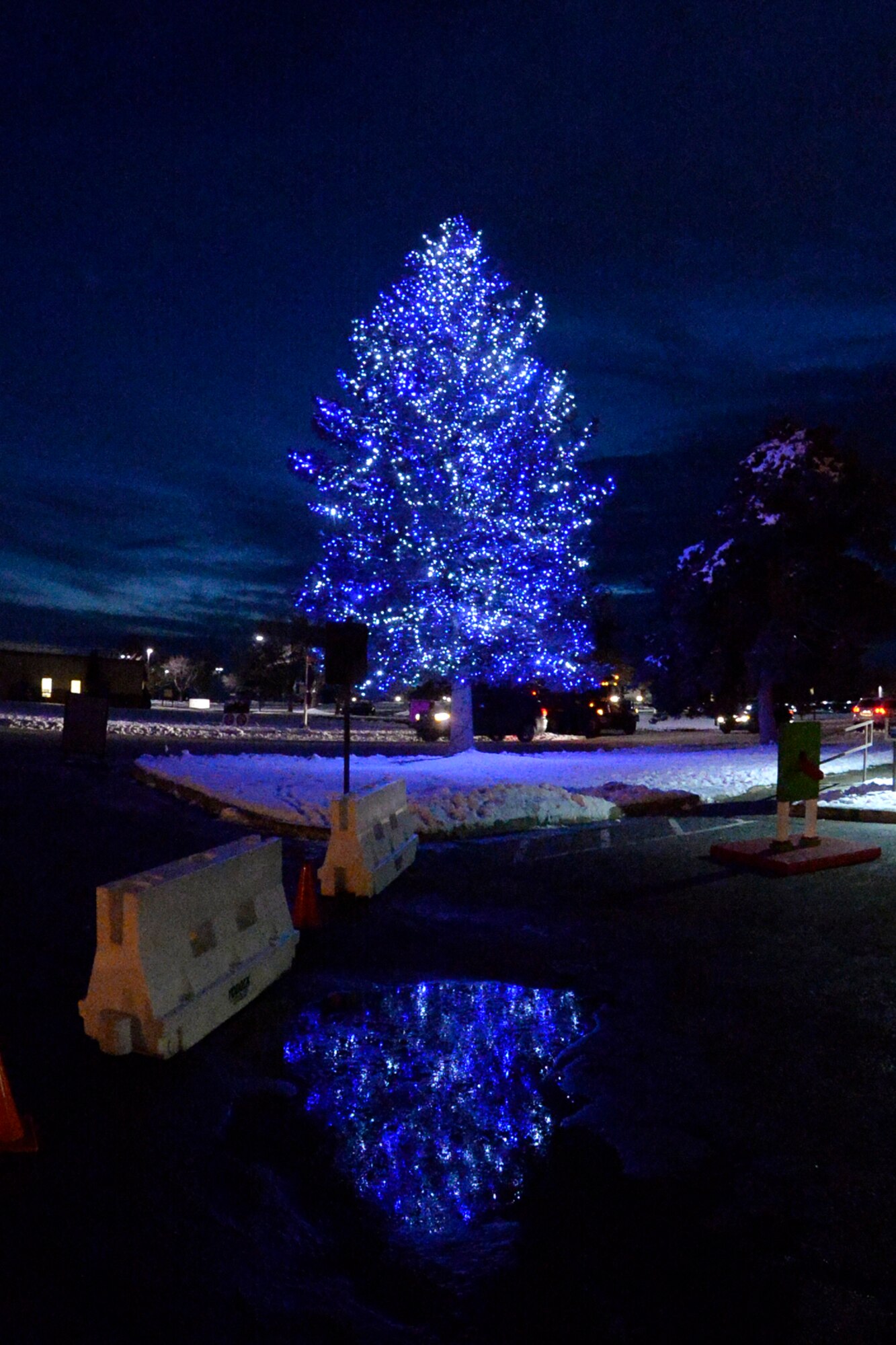 Hill Air Force Base Christmas stands in front of the Arts & Crafts Center after being lit for the first time Nov. 30. (U.S. Air Force photo by Todd Cromar)