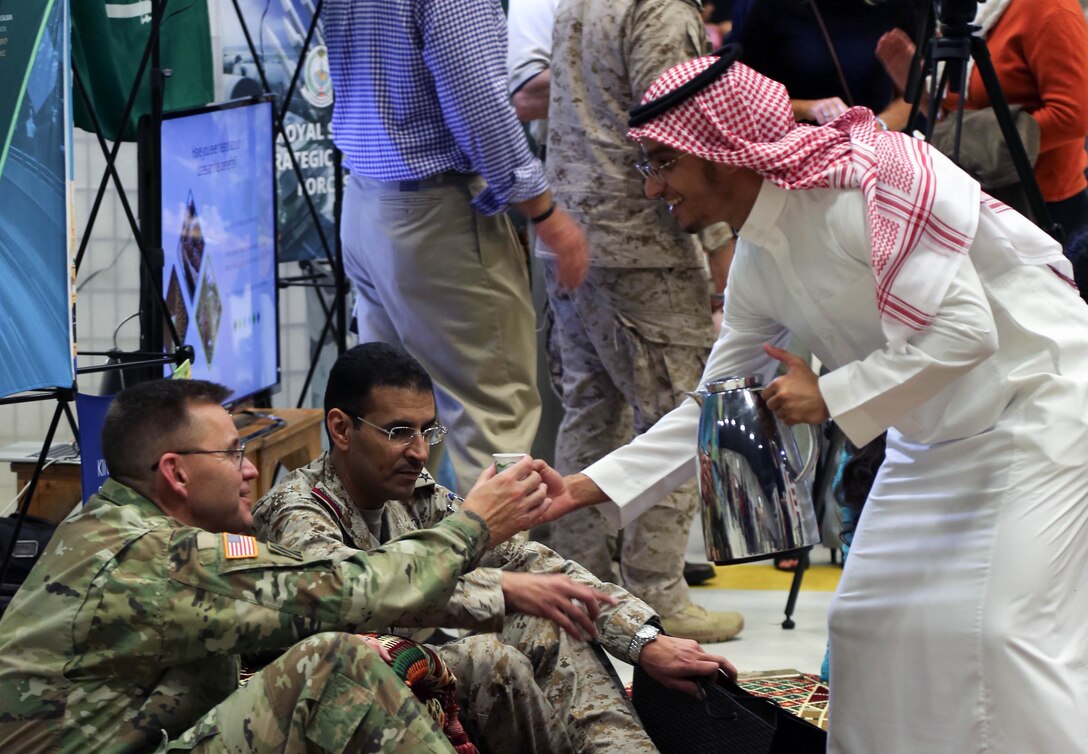 (Dec.1, 2016) Army Major General Terry Ferrell, Chief of Staff, U.S. Central Command accepts coffee at the Saudi Arabian exhibit at Coalition International Night on MacDill AFB. Coalition Night is an annual tradition that allows military members and families to become more familiar with various native cuisines, customs and dress of the different countries represented in the U.S. Central Command Coalition Village. (Photo by Tom Gagnier)


