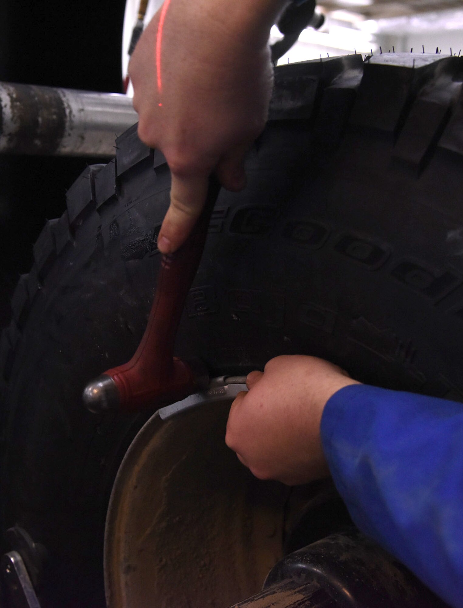 Staff Sgt. Benjamin Fisher, 341st Logistics Readiness Squadron vehicle maintenance journeyman, left, and Airman 1st Class Johnathan Allen, 341st Logistics Readiness Squadron vehicle maintenance apprentice, air up a semi-truck tire with a tire machine at the LRS tire shop Dec. 1, 2016, at Malmstrom Air Force Base, Mont. The tire machine is used to make it easier to conduct work on the tire by adding air or using a sealant. (U.S. Air Force photo/Senior Airman Jaeda Tookes)






