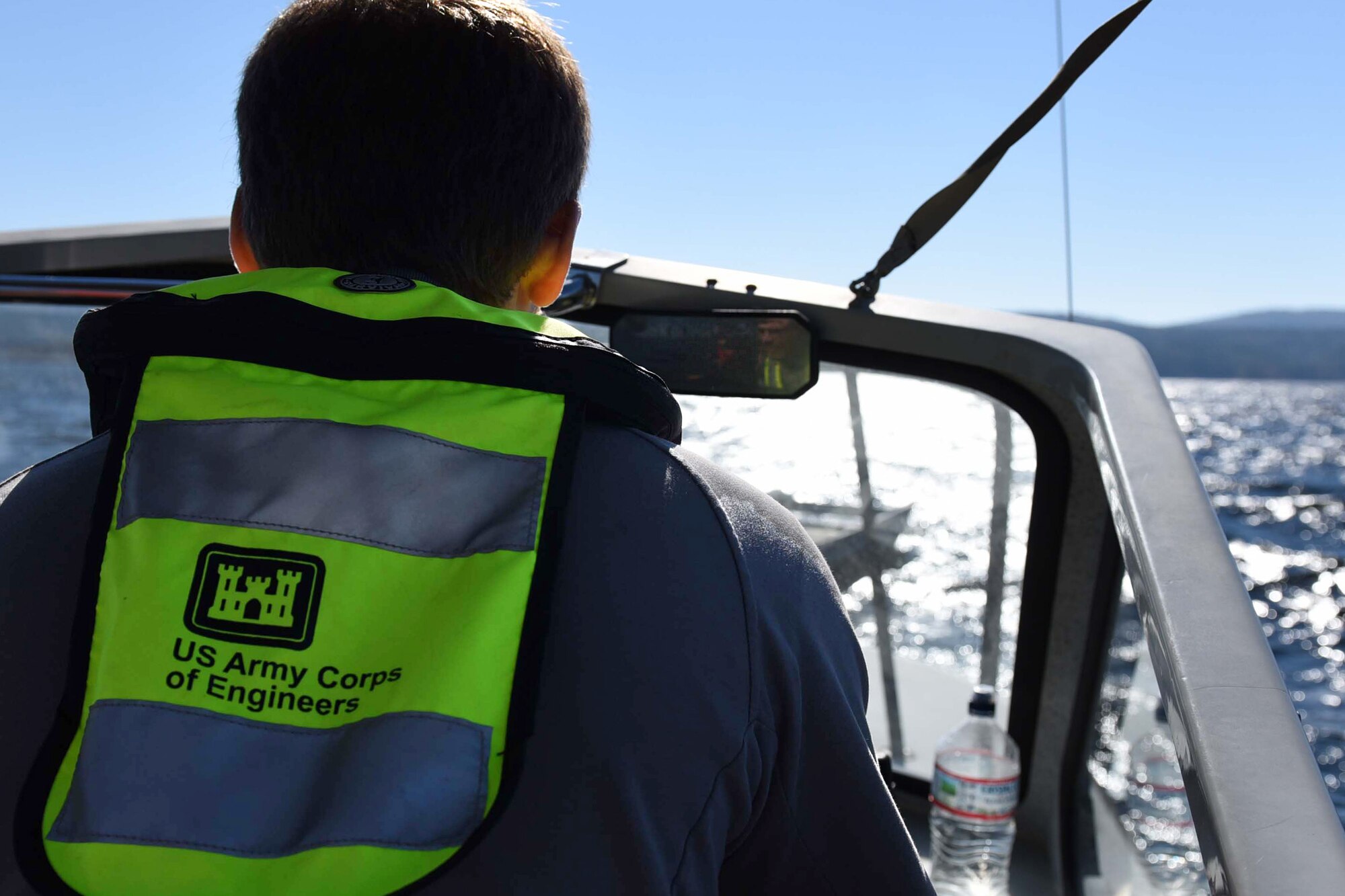 A member of the U.S. Army Corps of Engineers operates a boat during the first-ever search and rescue exercise of the Turkey Shoot competition Nov. 17, 2016, at Lake Ouachita, Ark. Little Rock Air Force Base continuously partners with Arkansas agencies to execute training exercises throughout the state. (U.S. Air Force photo by Airman 1st Class Kevin Sommer Giron)
