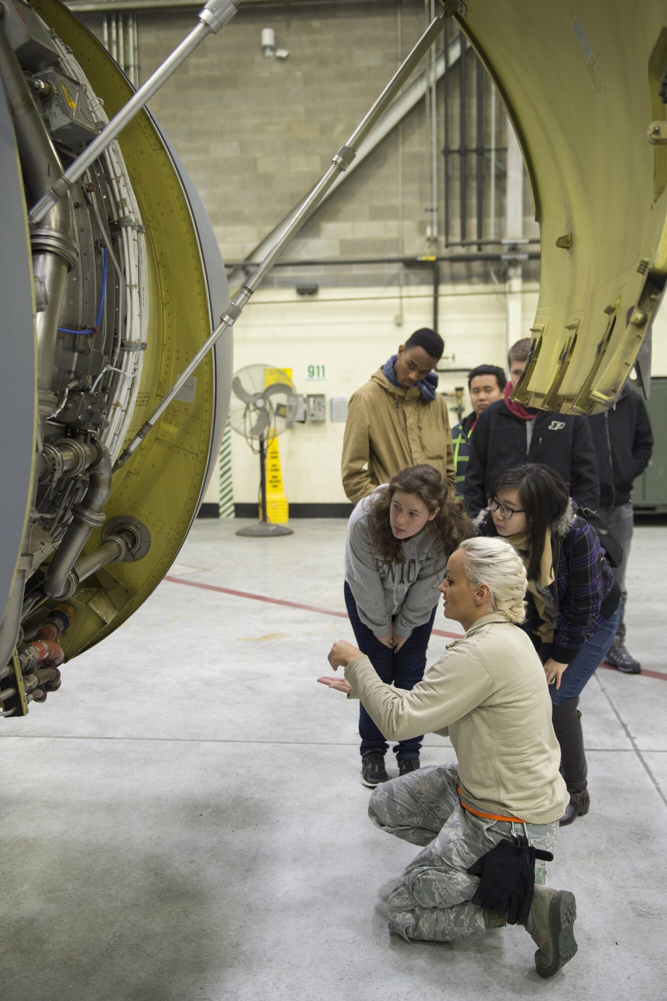 Staff Sgt. Caroline Taylor, 434th Aircraft Maintenance crew chief, explains the inner workings of a KC-135R Stratotanker engine to aviation students from Purdue University, Ind. during a visit to Grissom Air Reserve Base, Ind., Nov. 16, 2016. During the visit, students had an opportunity to speak with aircrew to learn more about Grissom and the careers of the men and women who work here. (U.S. Air Force photo/Tech. Sgt. Benjamin Mota)