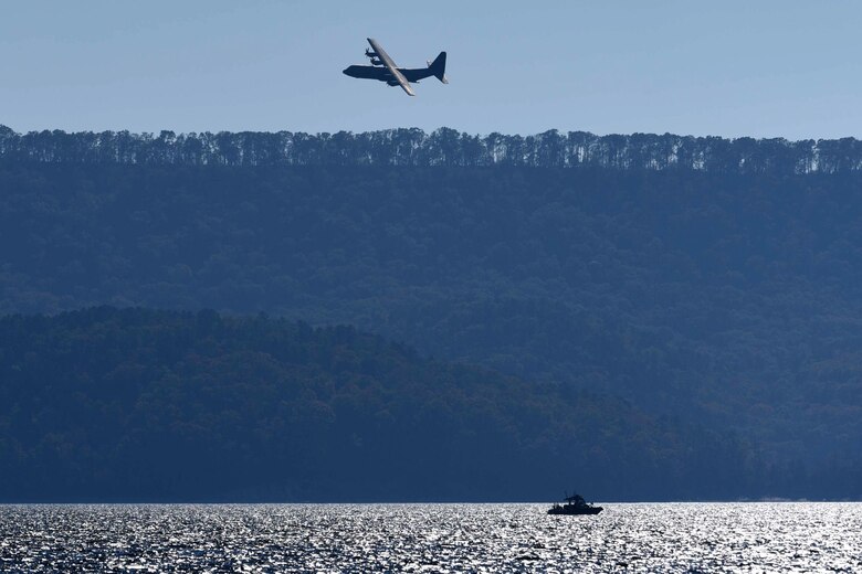 A C-130J assigned to the 19th Airlift Wing enters the assessment area during a search and rescue exercise as part of a Turkey Shoot competition, Nov. 17, 2016, at Lake Ouachita, Ark. Each aircraft had 30 minutes to search the area, locate the objective and drop supplies nearest to the target.  (U.S. Air Force photo by Airman 1st Class Kevin Sommer Giron)
