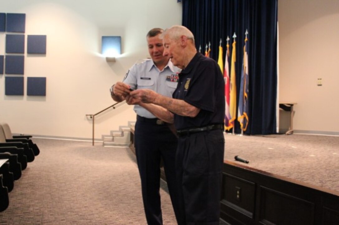 AFOSI Command Chief Master Sgt. Christopher VanBurger presents Honorary Special Agent credentials to guest speaker, Chief Master Sergeant of the Air Force #5 Robert D. Gaylor during the 2016 AFOSI SNCO Professional Development Seminar at Joint Base San Antonio-Lackland, Texas. (Courtesy photo)