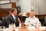 Defense Secretary Ash Carter speaks with the Senior Enlisted Advisor to the Chairman of the Joint Chiefs Command Sgt. Maj. John Troxell during the Defense Senior Enlisted Leader's Council at the Pentagon in Washington, D.C., Nov. 30, 2016.