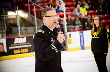 Lt. Col. Robert Grierson, G3 Operations Chief, 85th Support Command, conducts an oath of enlistment for new enlistees during a swearing in ceremony at the United States Hockey League's Dubuque Fighting Saints hockey game in Dubuque, Iowa, Nov. 11, 2016.
(Photo courtesy of Fighting Saints Hockey and Dale Stierman)