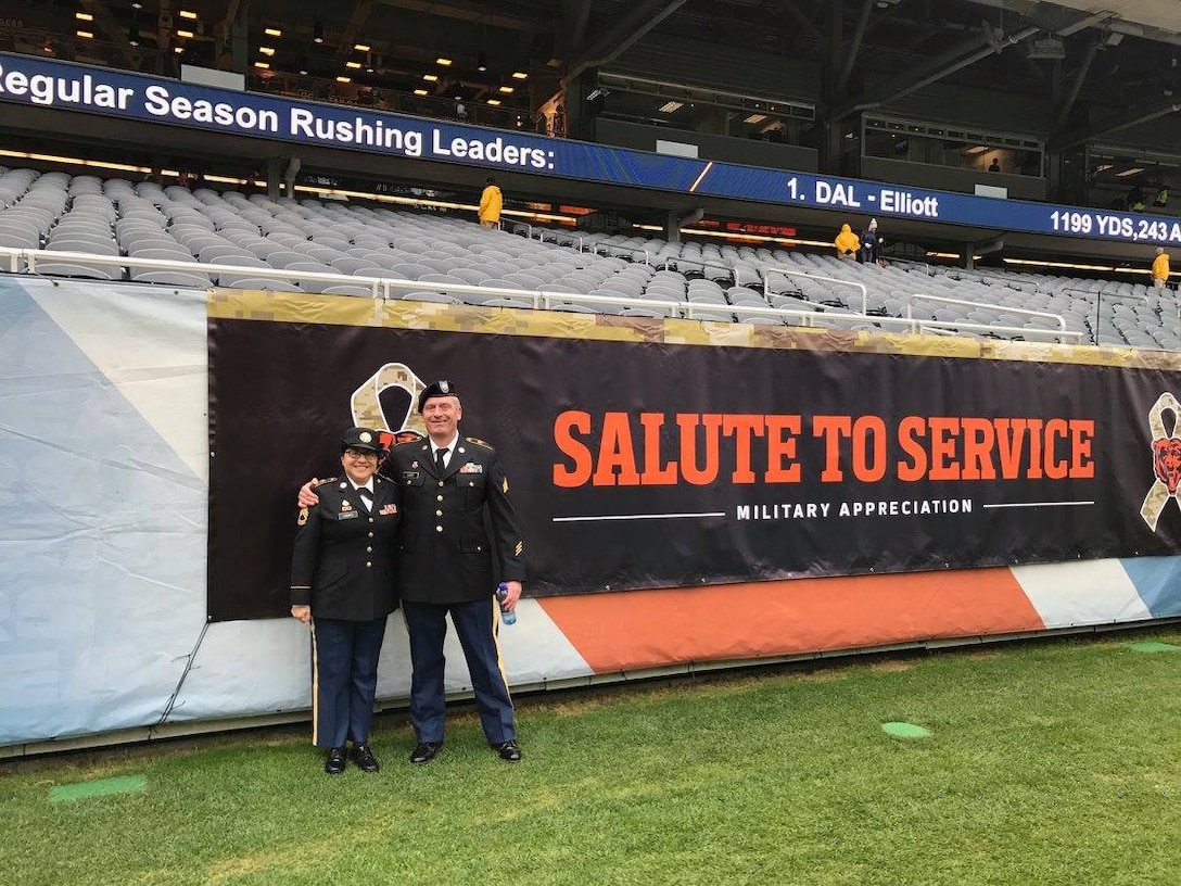 Sgt. 1st Class Susan Torres, left, and Sgt. David Lietz, formerly assigned to the 85th Support Command pause for a photo during the Chicago Bears 'Salute To Service' Veterans Day game at Soldier Field, Nov. 27, 2016. More than 100 service members participated in a on-field flag unfurling to kick off the game there in front of a near 60,000 spectators.
(Courtesy photo) 
