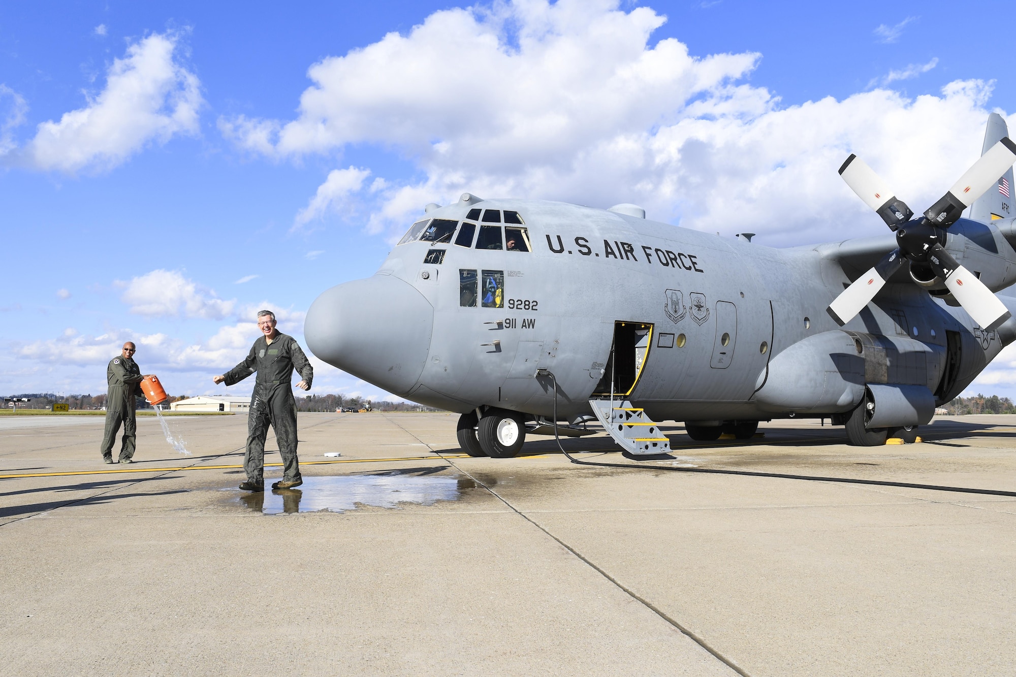 Lt. Col. Stan George, navigator with the 911th Operations Group, is welcomed by wing members after his Fini Flight at the Pittsburgh International Airport Air Reserve Station, Pennsylvania, Nov. 29, 2016. George has been in the Air Force since 1980, when he attended the Air Force Officer Training School. (U.S. Air Force photo by Airman 1st Class Beth Kobily)