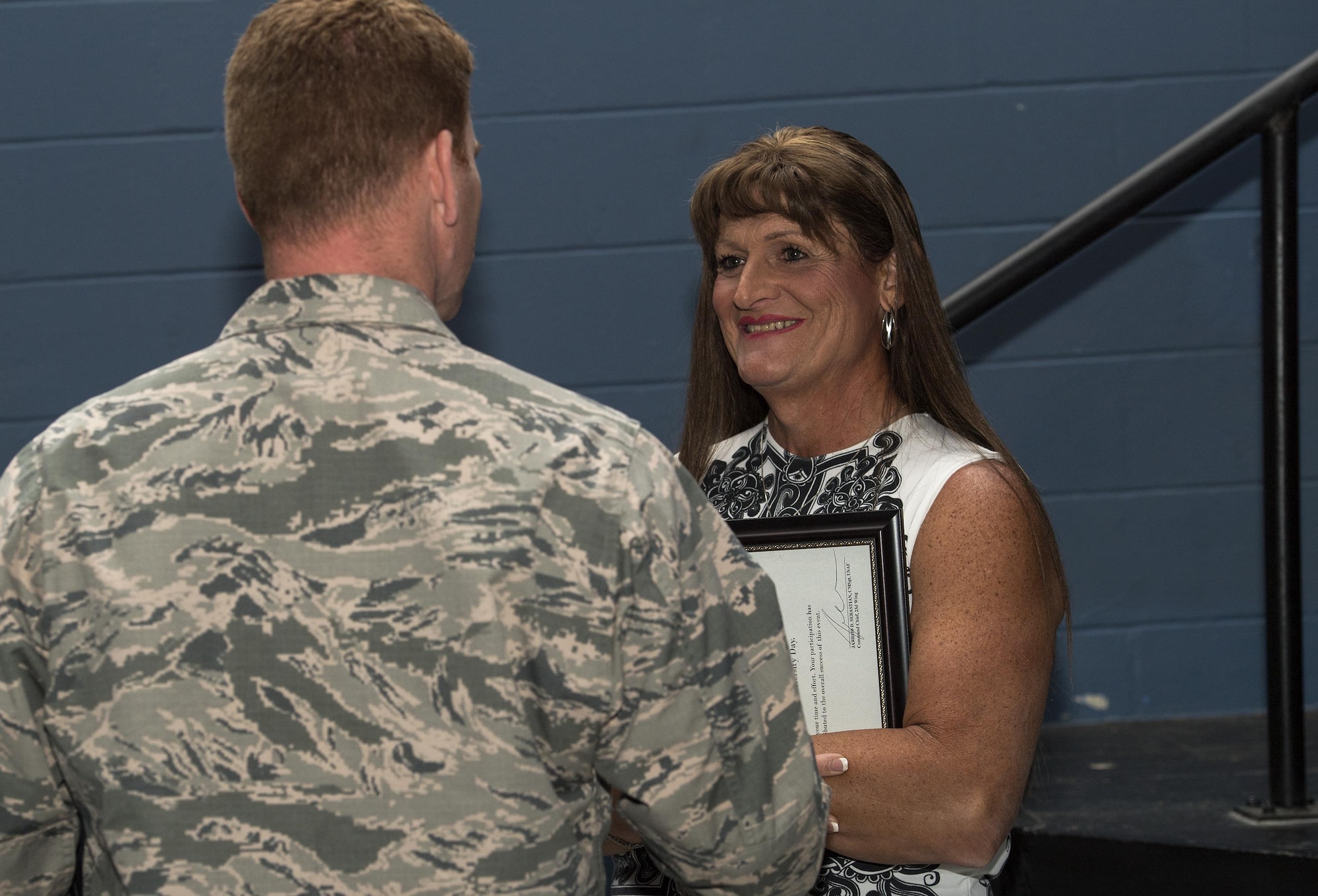 Retired U.S. Air Force Maj. Laura Perry, 45th Medical Operations Squadron master social worker, talks with an attendee after a speaking engagement, Dec. 2, 2016, at Moody Air Force Base, Ga. Perry was instrumental in the fight for transgender military members to openly serve and travels the country sharing her story. (U.S. Air Force photo by Airman 1st Class Janiqua P. Robinson)
