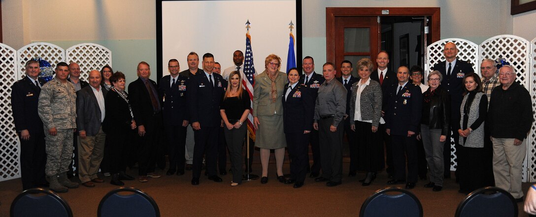 Commanders and honorary commanders pose for a group photo, Nov. 30, at McConnell Air Force Base, Kan. The honorary commander program spreads awareness of McConnell’s mission and build connections between the base and the community. (U.S. Air Force photo/Airman 1st Class Jenna Caldwell)