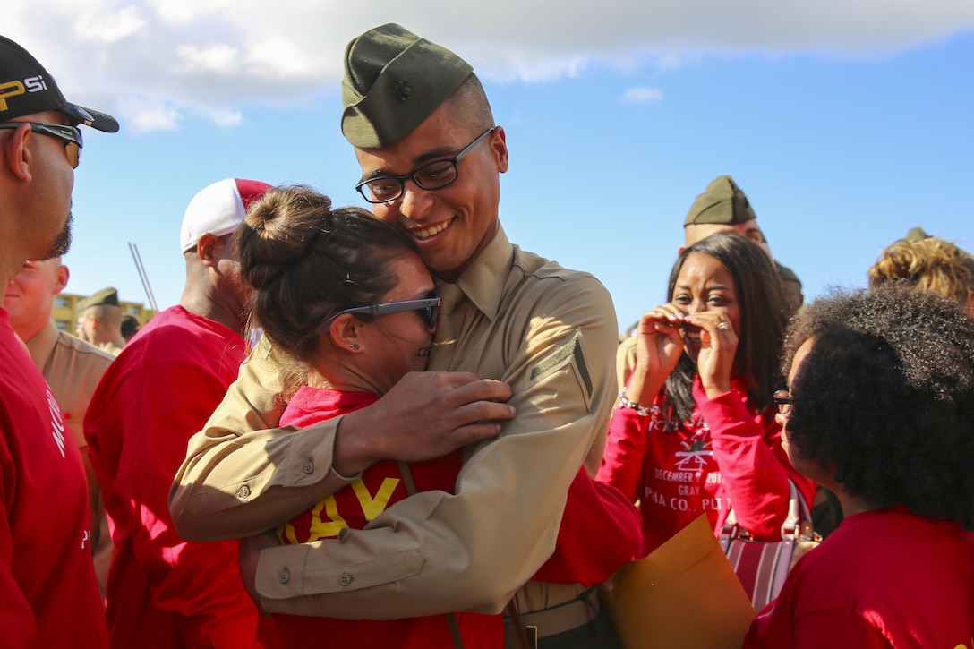 A Marine hugs a loved one after being released for liberty at Marine Corps Recruit Depot San Diego, Dec. 1, 2016. The Marine is assigned to the 1st Recruit Training Battalion's Alpha Company, which was scheduled to graduate Dec. 2. Marine Corps photo by Cpl. Angelica I. Annastas