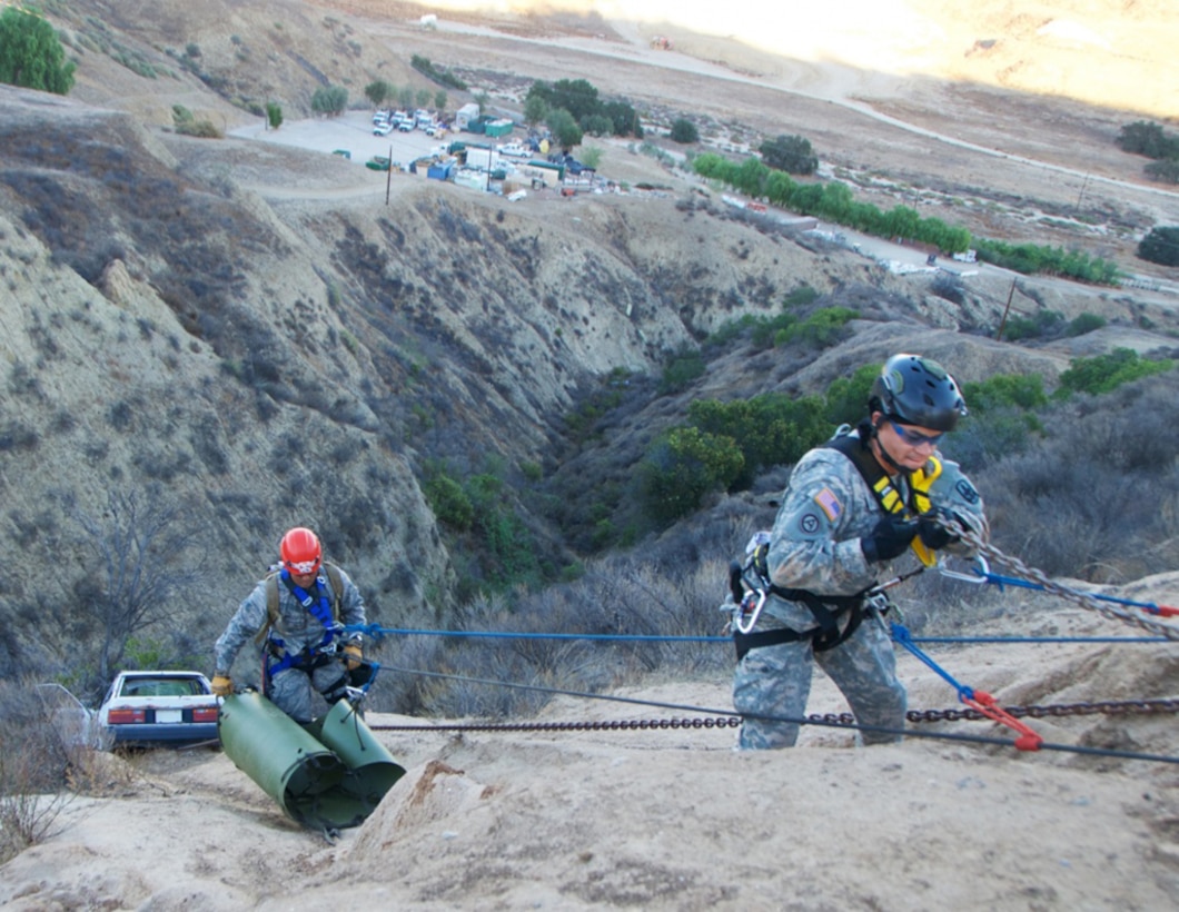 In this file photo, a Hawaii Air Natioanl Guard Airmen and Hawaii Army National Guard Soldier repel down a cliff to a car wreck prop during a cliff rescue scenario at Exercise Vigilant Guard 2017, Delle Valle Regional Center, California, Nov. 17, 2016. The service members are part of a Hawaii Natonal Guard team that focuses on emergency response. Vigilant Guard is an exercise program sponsored by United States Northern Command in conjunction with National Guard Bureau to provide State National Guards an opportunity to improve cooperation and relationships with their regional civilian, military, and federal partners in preparation for emergencies and catastrophic events. 