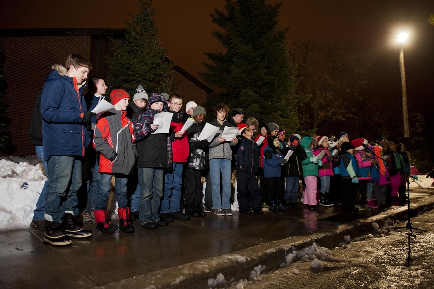 Children sing for Airmen and their families during the annual tree lighting ceremony at Minot Air Force Base, N.D., Dec. 1, 2016. The event offered an opportunity for Team Minot families to usher in the holiday season together. (U.S. Air Force photo/Airman 1st Class J.T. Armstrong)