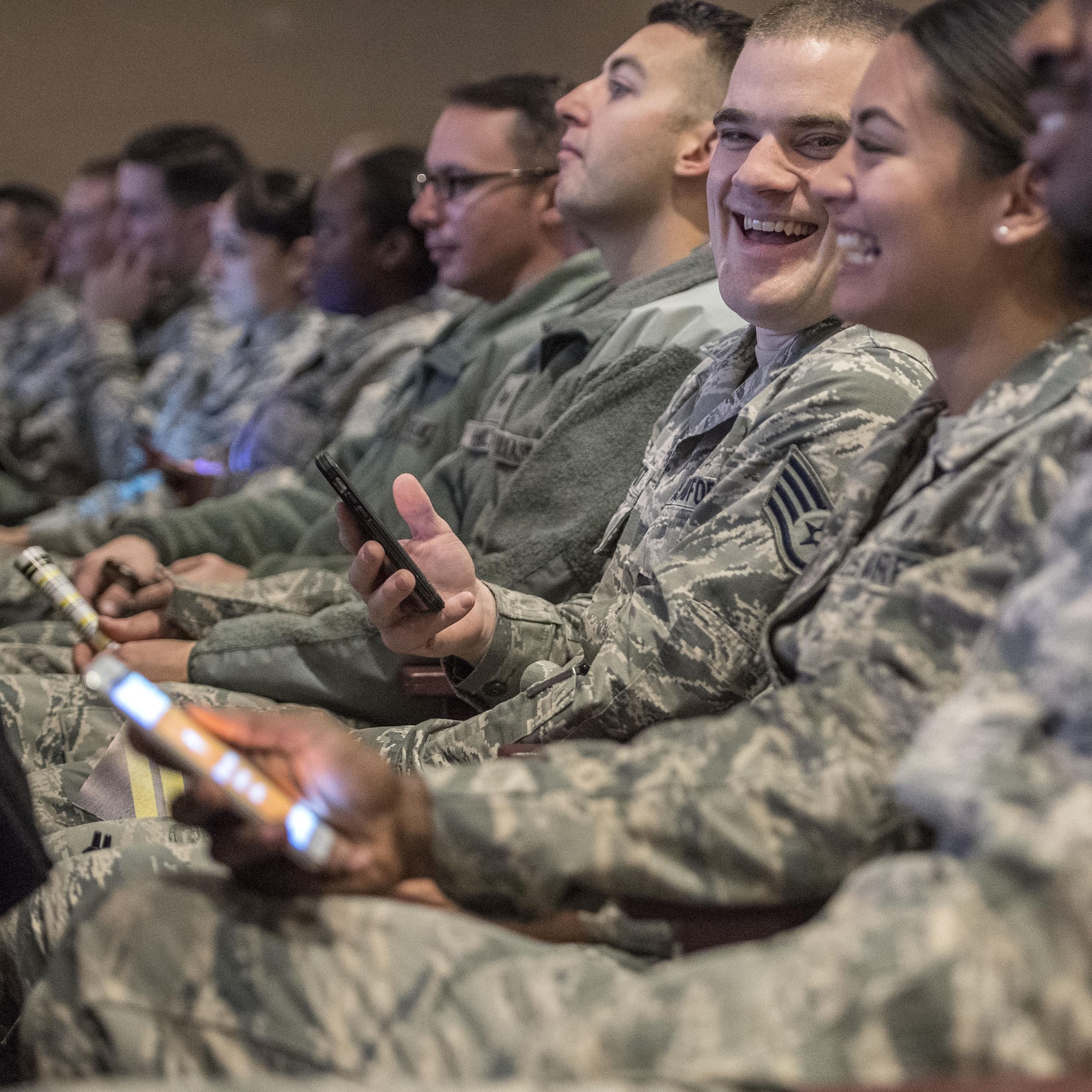 Airmen from the 75h Medical Group use their cell phones to answer survey questions during a DUI and distracted driving event Dec. 2 at Hill Air Force Base. (U.S. Air Force photo by Paul Holcomb)