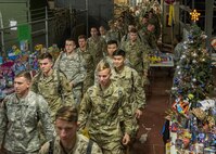 Army explosive ordnance disposal students deliver gifts for the base’s annual toy drive at Eglin Air Force Base, Fla, Dec. 1.  After base retreat, the formation marched over to Bldg. 615 to drop off the toys.  (U.S. Air Force photo/Samuel King Jr.)