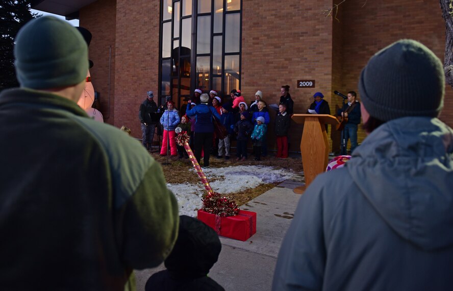 Families gather in front of Freedom Chapel during the 28th Bomb Wing tree lighting ceremony at Ellsworth Air Force Base, S.D., Dec. 1, 2016. Attendees were treated with Christmas carols, the lighting of the tree and a surprise visit from Santa. (U.S. Air Force photo by Airman 1st Class James L. Miller/Released)