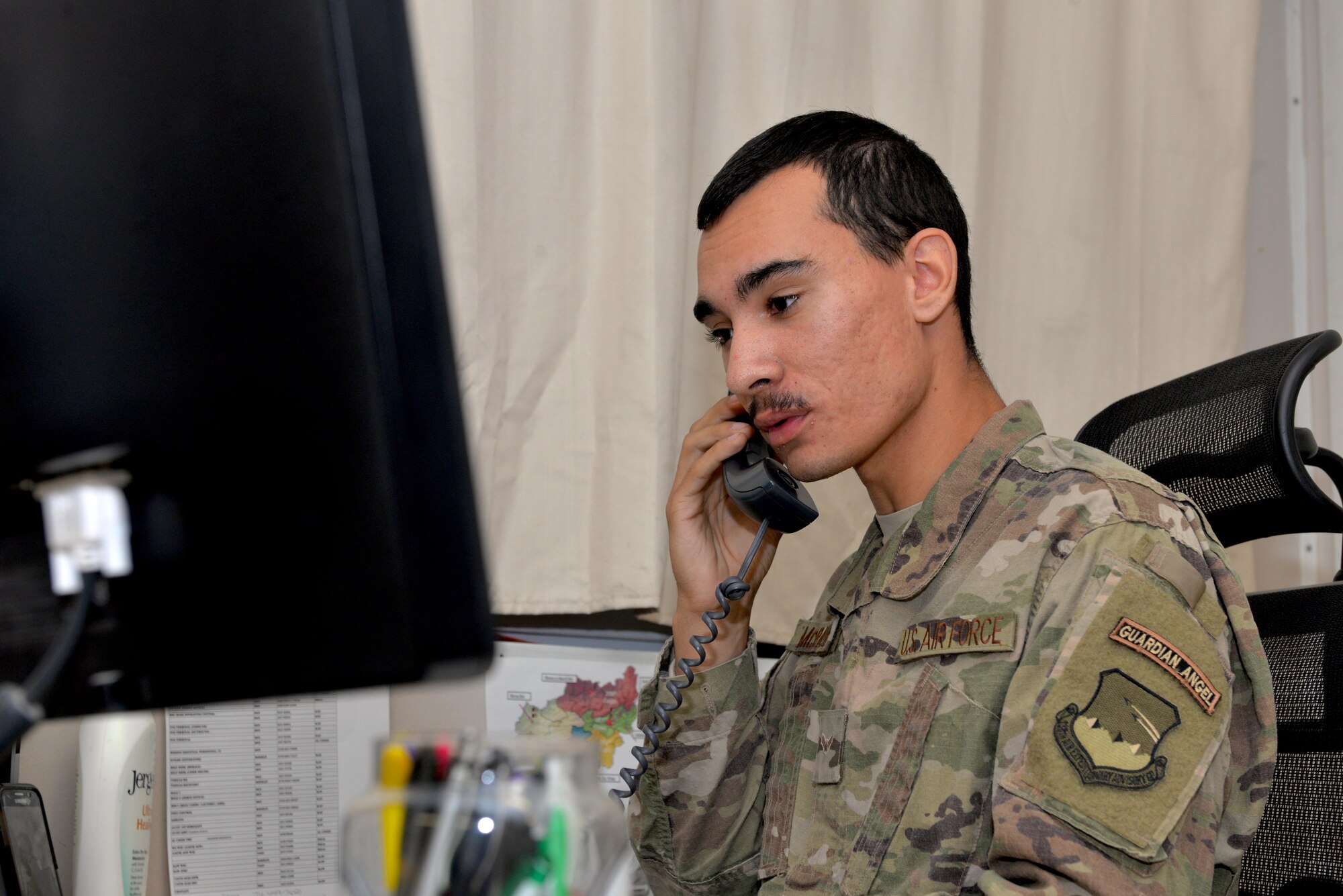 Airman 1st Class Steven McRavin, 738th Air Expeditionary Group guardian angel, talks to President Barack Obama at Kandahar Airfield, Afghanistan, Nov. 24, 2016. McRavin was one of 10 deployed military members chosen to receive the traditional Thanksgiving phone call from the president. (U.S. Air Force photo by Tech. Sgt. Christopher Holmes)
