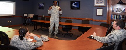 Master Sgt. George Higgins, Air Force Reserve recruiter briefs active duty service members about the palace chase program Dec. 1 at Joint Base San Antonio-Randolph. This program allows active-duty members to separate early in exchange for an additional commitment with the AFR or Air National Guard.