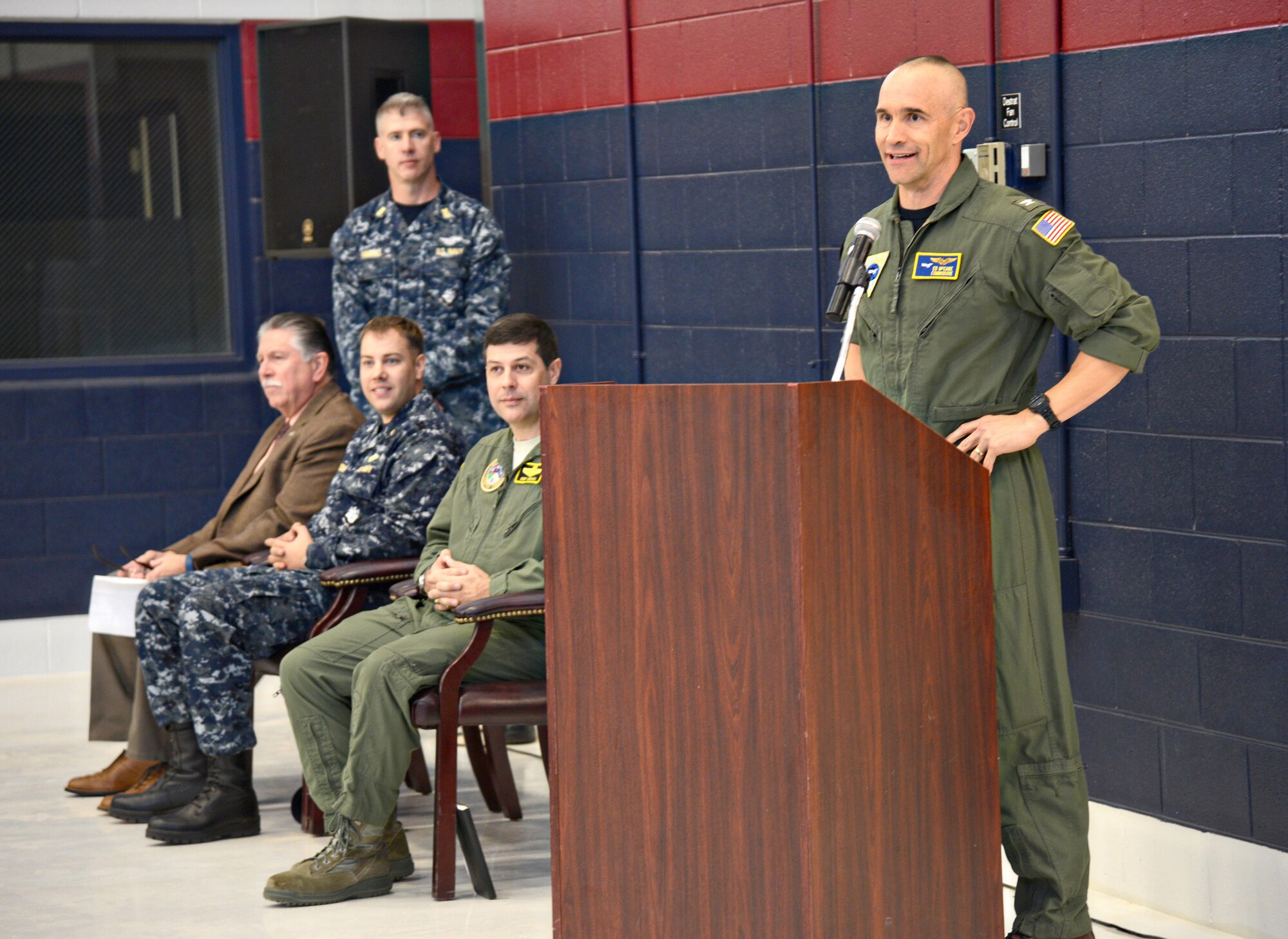 Capt. Ed McCabe, commander of Strategic Communications Wing ONE and Task Force 124, thanks the many contributors to the successful construction of the new Navy hangar on the south side of base, Bldg. 824, during a ribbon cutting ceremony Nov. 22. The $17.8 million hangar will be able to accommodate depot-level maintenance and features sheet metal and machine shops, as well as several safety features. (Air Force photo by Kelly White)
