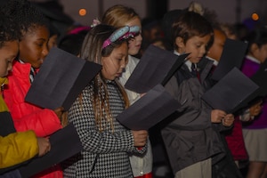 Imagine Andrews Public Charter School’s students sing holiday carols at the Christmas tree lighting on Joint Base Andrews, Md., Dec. 1, 2016. The children sang Deck the Halls and Jing Bells in front of base members. The tree lighting is an annual event that provides the base with a time to celebrate holiday cheer. (U.S. Air Force photo by Airman 1st Class Valentina Lopez)