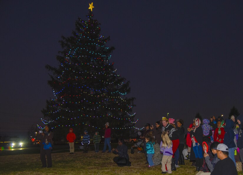 Base members attend the Christmas tree lighting at Chapel One on Joint Base Andrews, Md., Dec. 1, 2016. Once a year the Chapel starts the holiday season with a tree lighting that brings together base members and their families. (U.S. Air Force photo by Airman 1st Class Valentina Lopez)