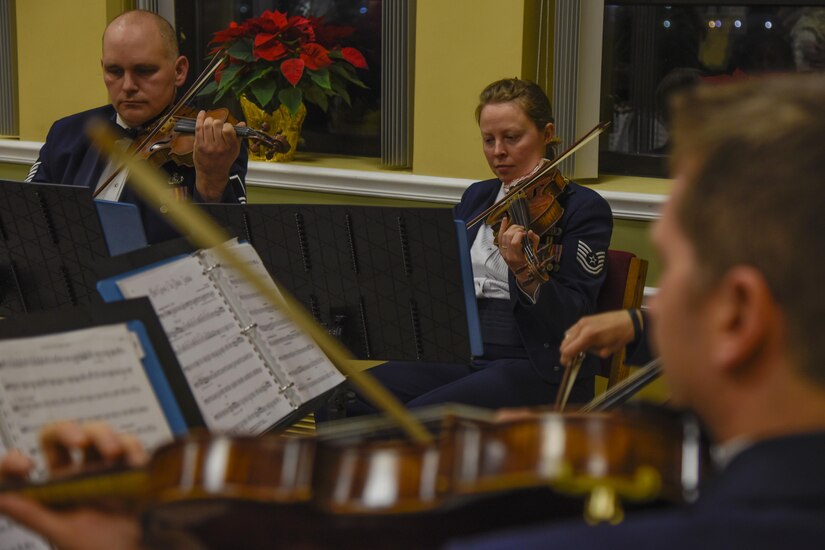 The United States Air Force Band String Quartet performs at the Christmas Tree Lighting Ceremony on Joint Base Andrews, Md., Dec. 1, 2016. The event provides the base with a sense of community and helps start up the holiday cheer. (U.S. Air Force photo by Airman 1st Class Valentina Lopez)
