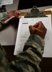 Tech. Sgt. Dwain Waldo, non-commissioned officer in charge of customer service assigned to the 28th Logistics Readiness Squadron, reviews a vehicle inspection checklist at Ellsworth Air Force Base S.D., Nov. 29, 2016. Customer service technicians ensure all government vehicles pass inspection before releasing it back to the customer. (U.S. Air Force photo by Airman 1st Class James L. Miller) 