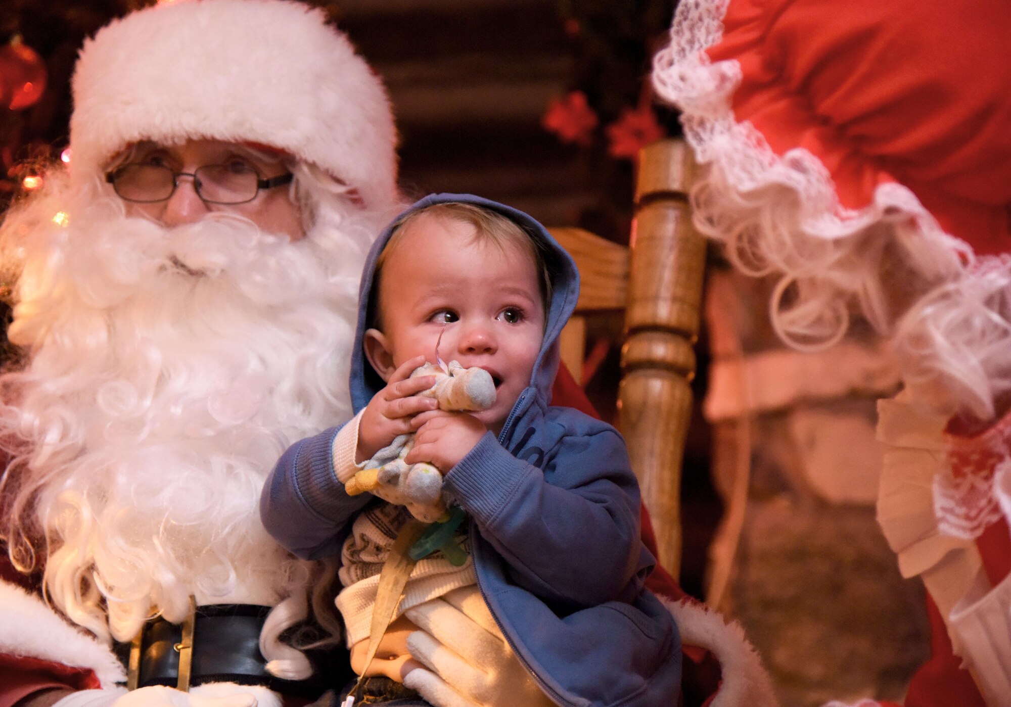 Colten Parkison, son of U.S. Navy Petty Officer 2nd Class Sean Parkison, Naval Mobile Construction Battalion 11 builder, Gulfport, Miss., visits with Santa and Mrs. Claus during Keesler’s annual Christmas in the Park celebration at Marina Park Dec. 1, 2016, on Keesler Air Force Base, Miss. The event, hosted by Outdoor Recreation, included a tree lighting ceremony, tour train rides, and cookie and ornament decorating. (U.S. Air Force photo by Kemberly Groue)