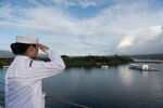 Seaman Eliza Manuel, from Memphis, Tennessee, salutes as USS John C. Stennis (CVN 74) passes the Arizona Memorial and arrives at Joint Base Pearl Harbor-Hickam to participate in National Pearl Harbor Remembrance Day events. Dec. 7, 2016, marks the 75th anniversary of the attacks on Pearl Harbor and Oahu. The U.S. military and the State of Hawaii are hosting a series of remembrance events throughout the week to honor the courage and sacrifices of those who served Dec. 7, 1941, and throughout the Pacific Theater. As a Pacific nation, the U.S. is committed to continue its responsibility of protecting the Pacific sea-lanes, advancing international ideals and relationships, as well as delivering security, influence and responsiveness in the region. 