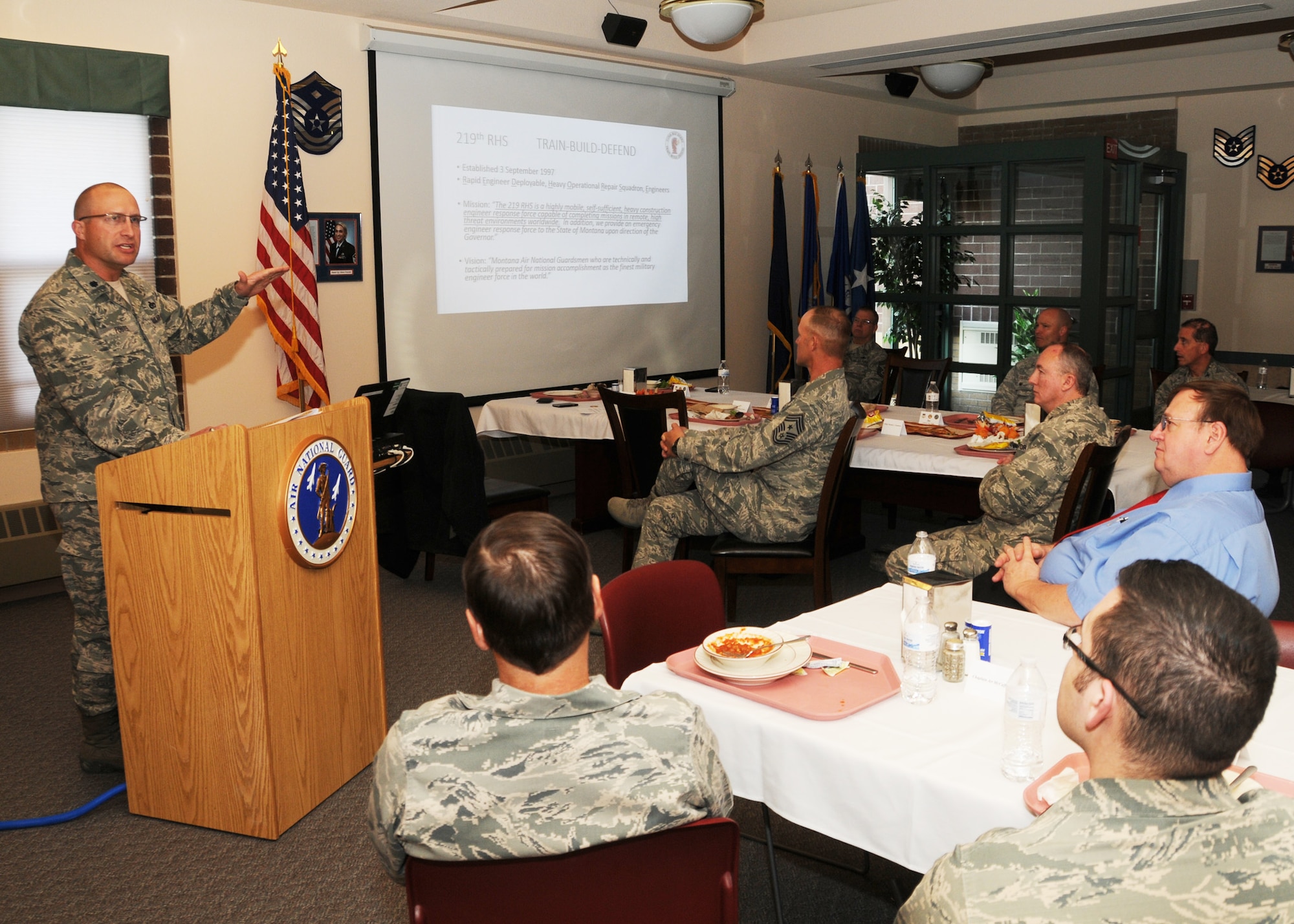 Montana Air National Guard 219th RED HORSE Squadron Deputy Commander Lt. Col. Jason Foster speaks to members of the Great Falls Area Chamber of Commerce Military Affairs Committee during their monthly lunch at the 120th Airlift Wing in Great Falls, Mont. Nov. 4, 2016. (U.S. Air National Guard photo/Senior Master Sgt. Eric Peterson)
