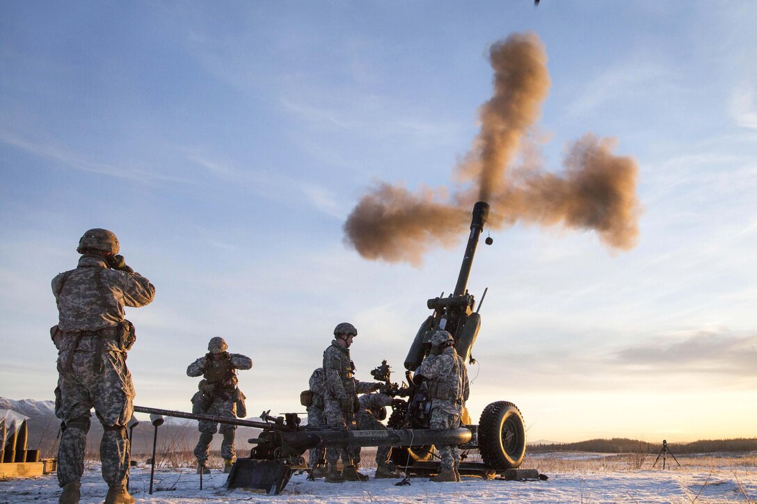 Paratroopers fire a 105 mm howitzer during live-fire training at Joint Base Elmendorf-Richardson, Alaska, Nov. 22, 2016. Air Force photo by Alejandro Pena