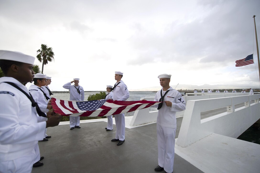 Sailors participate in an ash-scattering ceremony following the death of Pearl Harbor attacks survivor Jack A. Stoeber at the USS Utah Memorial, Hawaii, Dec. 1, 2016. On Dec. 7, 1941, Stoeber was serving aboard the USS Whitney in Pearl Harbor. Navy photo by Petty Officer 2nd Class Gabrielle Joyner