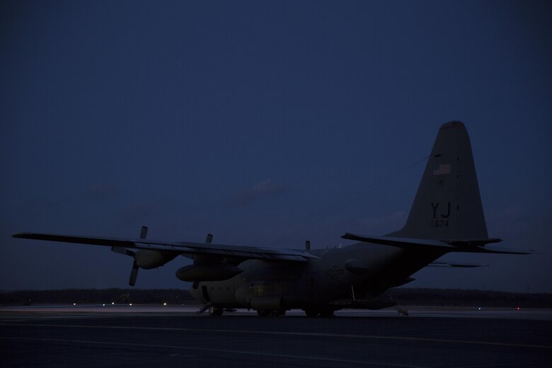 A U.S. Air Force C-130J waits to be unloaded after transporting U.S. Marines with Marine Attack Squadron 542 (VMA) 542 to Chitose Air Base, Japan, Dec. 2, 2016. VMA-542 journeyed to Chitose to partake in the Aviation Relocation Training program in an effort to increase operational readiness between the U.S. Marine Corps and the Japan Air Self Defense Force, improve interoperability and reduce noise concerns of aviation training on local communities by disseminating training locations throughout Japan.