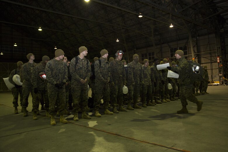 U.S. Marine Corps Sgt. Maj. Brandon Eckardt, sergeant major of Marine Attack Squadron 542 (VMA) 542, briefs his Marines upon arrival at Chitose Air Base, Japan, Dec. 2, 2016. VMA-542 journeyed to Chitose to partake in the Aviation Relocation Training program in an effort to increase operational readiness between the U.S. Marine Corps and the Japan Air Self Defense Force, improve interoperability and reduce noise concerns of aviation training on local communities by disseminating training locations throughout Japan.