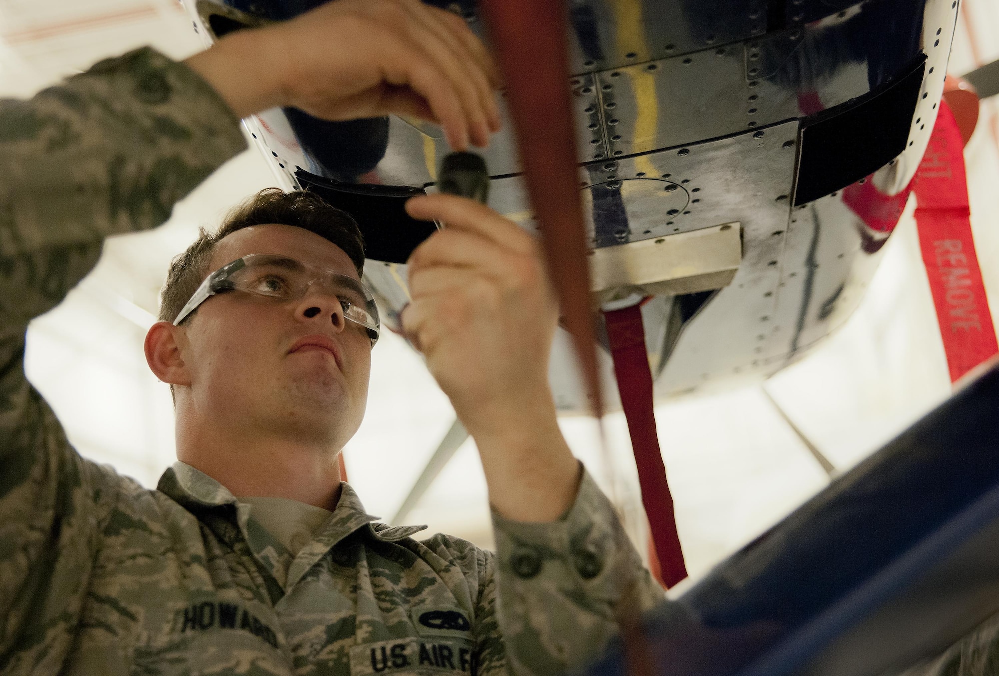 Staff Sgt. Michael Howard, 592nd Special Operations Maintenance Squadron perform maintenance on the fuel systems of a C-145 Skytruck in a hangar at Duke Field Fla., Feb. 25.  The Airmen are part of the fuel systems shop within the 919th Special Operations Maintenance Group.  (U.S. Air Force photo/Tech. Sgt. Sam King)