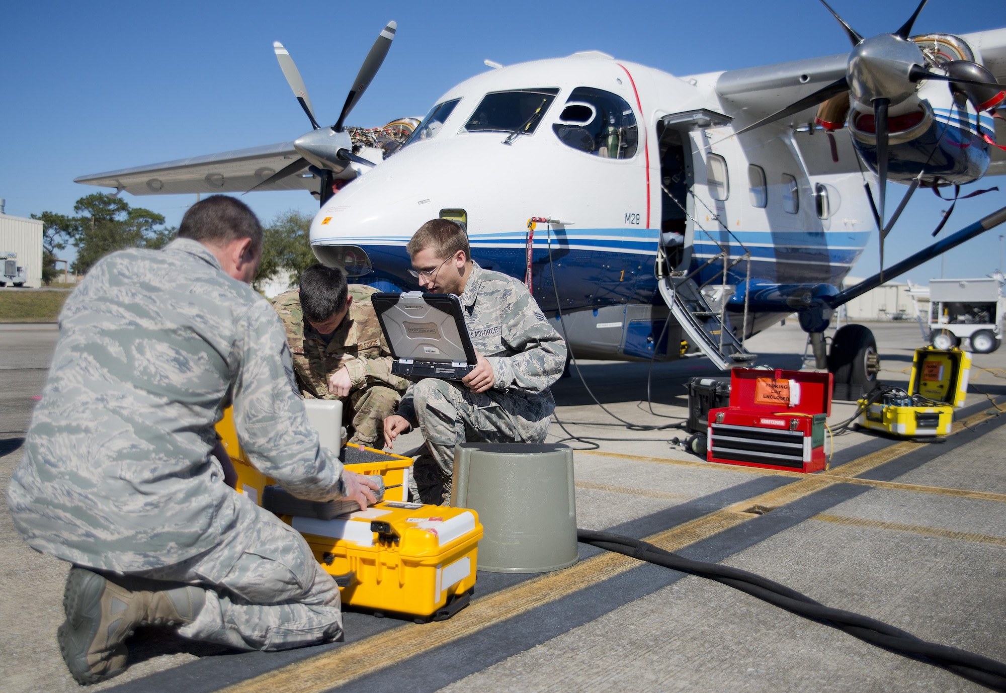 Active and Reserve Airmen from the 919th Special Operations Maintenance Group use a pitot static test set on a C-145 Skytruck to check the accuracy of flight indicators  at Duke Field Fla., Feb. 25.  The Airmen are part of the avionics shop of the Wing’s maintenance group.  (U.S. Air Force photo/Tech. Sgt. Sam King)