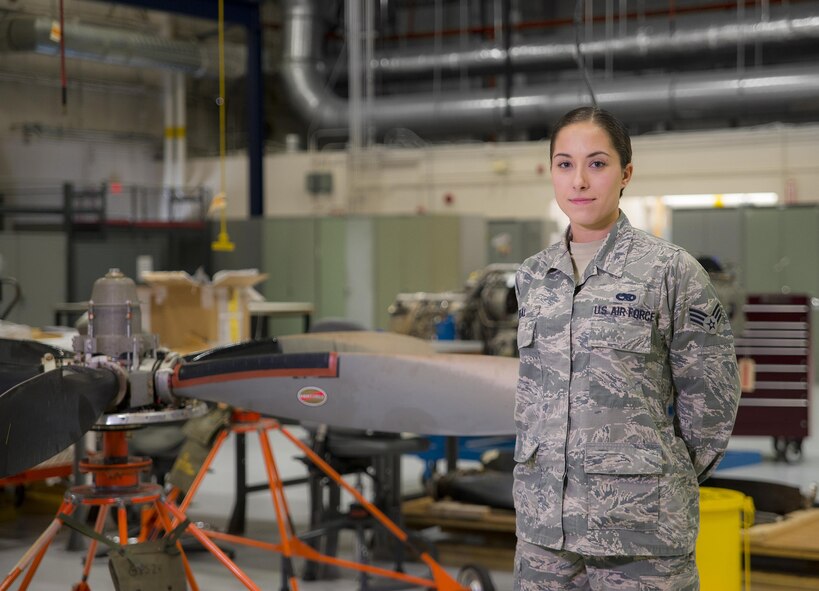 Senior Airman Natalie Beal, 919th Special Operations Maintenance Group, stands by a C-146 Wolfhound propellor at Duke Field Fla., Feb. 25.  The Airmen are part of the engine shop of the 919th Special Operations Maintenance Group.  (U.S. Air Force photo/Tech. Sgt. Sam King)