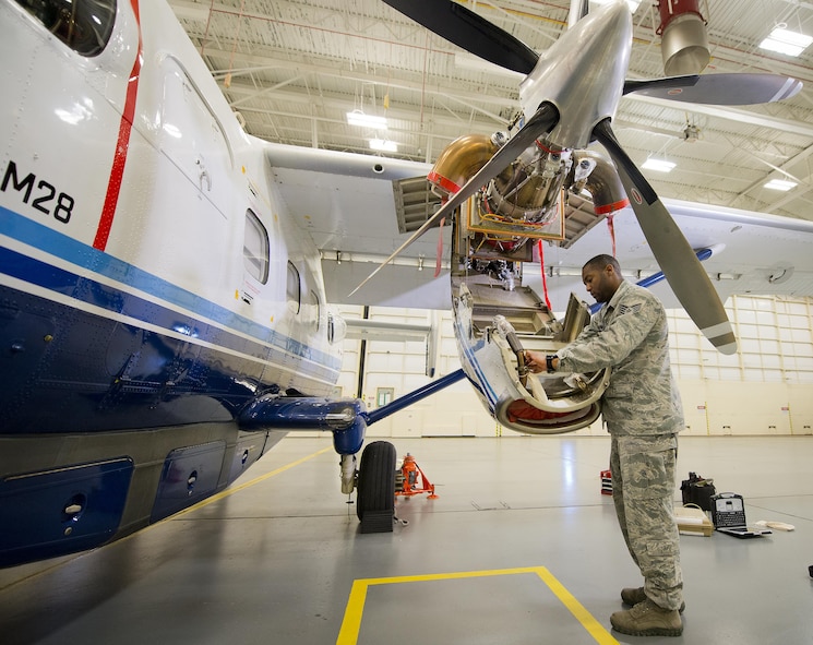 A 919th Special Operations Maintenance Group Airman checks the fuel system on a C-145A Skytruck.  (U.S. Air Force photo/Tech. Sgt. Sam King)