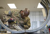 Tech. Sgt. Rodrick Hall, 919th Maintenance Squadron, replaces a broken piece of equipment off of a C-145 Skytruck at Duke Field, Fla., Feb. 25.  Hall is part of the 919th Special Operations Maintenance Group’s fabrication shop.  (U.S. Air Force photo/Tech. Sgt. Sam King)  