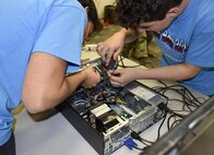 Kids put together a desktop computer at this year’s Tech Bowl in Niceville Fla., Nov. 5.  919th Special Operations Communications Squadron reservists acted as timekeepers and judges for the youth competition.  (Courtesy photo)