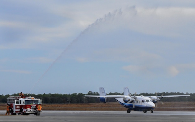 Firefighters shoot a jet of water over a 145A Skytruck after a fini-flight sortie at Duke Field, Fla., Dec. 2.  (U.S. Air Force photo/Dan Neely)