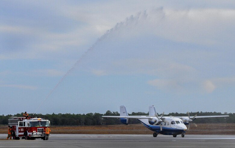Firefighters shoot a jet of water over a 145A Skytruck after a fini-flight sortie at Duke Field, Fla., Dec. 2.  (U.S. Air Force photo/Dan Neely)