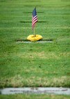 A commemorative U.S. flag rests next to a gravemarker at the National Memorial Cemetery of the Pacific, Honolulu, Hawaii, Dec. 3, 2016. The flag was placed by U.S. Airmen during a commemoration ceremony honoring the courage, service and sacrifice of the U.S. military personnel who died during the attacks on Pearl Harbor and Oahu on Dec. 7, 1941. Dec. 7, 2016 marks the 75th anniversary of the attacks and the U.S. military and the State of Hawaii are hosting a series of remembrance events to honor the Pacific Theater's veterans. (U.S. Air Force photo by Tech. Sgt. James Stewart/Released)