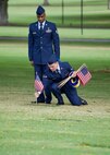 U.S. Air Force Staff Sgt. Johnnie Anderson and Airman 1st Class Andrew Titus, dental technicians with the 15th Aeromedical Squadron, place a commemorative U.S. flag near a gravemarker at the National Memorial Cemetery of the Pacific, Honolulu, Hawaii, Dec. 3, 2016. Anderson and Titus placed multiple flags during a commemoration ceremony honoring the courage, service and sacrifice of the U.S. military personnel who died during the attacks on Pearl Harbor and Oahu on Dec. 7, 1941. Dec. 7, 2016 marks the 75th anniversary of the attacks and the U.S. military and the State of Hawaii are hosting a series of remembrance events to honor the Pacific Theater's veterans. (U.S. Air Force photo by Tech. Sgt. James Stewart/Released)