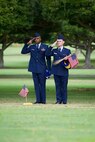 U.S. Air Force Staff Sgt. Johnnie Anderson and Airman 1st Class Andrew Titus, dental technicians with the 15th Aeromedical Squadron, salute a fallen U.S. servicemember's  gravemarker at the National Memorial Cemetery of the Pacific, Honolulu, Hawaii, Dec. 3, 2016. Anderson and Titus placed multiple flags during a commemoration ceremony honoring the courage, service and sacrifice of the U.S. military personnel who died during the attacks on Pearl Harbor and Oahu on Dec. 7, 1941. Dec. 7, 2016 marks the 75th anniversary of the attacks and the U.S. military and the State of Hawaii are hosting a series of remembrance events to honor the Pacific Theater's veterans. (U.S. Air Force photo by Tech. Sgt. James Stewart/Released)