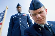 U.S. Air Force Staff Sgt. Johnnie Anderson and Airman 1st Class Andrew Titus, dental technicians with the 15th Aeromedical Squadron, place a commemorative U.S. flag near a gravemarker at the National Memorial Cemetery of the Pacific, Honolulu, Hawaii, Dec. 3, 2016. Anderson and Titus placed multiple flags during a commemoration ceremony honoring the courage, service and sacrifice of the U.S. military personnel who died during the attacks on Pearl Harbor and Oahu on Dec. 7, 1941. Dec. 7, 2016 marks the 75th anniversary of the attacks and the U.S. military and the State of Hawaii are hosting a series of remembrance events to honor the Pacific Theater's veterans. (U.S. Air Force photo by Tech. Sgt. James Stewart/Released)