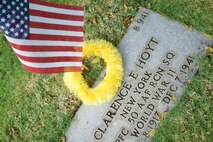 A commemorative U.S. flag rests next to U.S. Army Air Forces Pfc. Clarence Hoyt's gravemarker at the National Memorial Cemetery of the Pacific, Honolulu, Hawaii, Dec. 3, 2016. The flag was placed by U.S. Airmen during a commemoration ceremony honoring the courage, service and sacrifice of the U.S. military personnel who died during the attacks on Pearl Harbor and Oahu on Dec. 7, 1941. Dec. 7, 2016 marks the 75th anniversary of the attacks and the U.S. military and the State of Hawaii are hosting a series of remembrance events to honor the Pacific Theater's veterans. (U.S. Air Force photo by Tech. Sgt. James Stewart/Released)