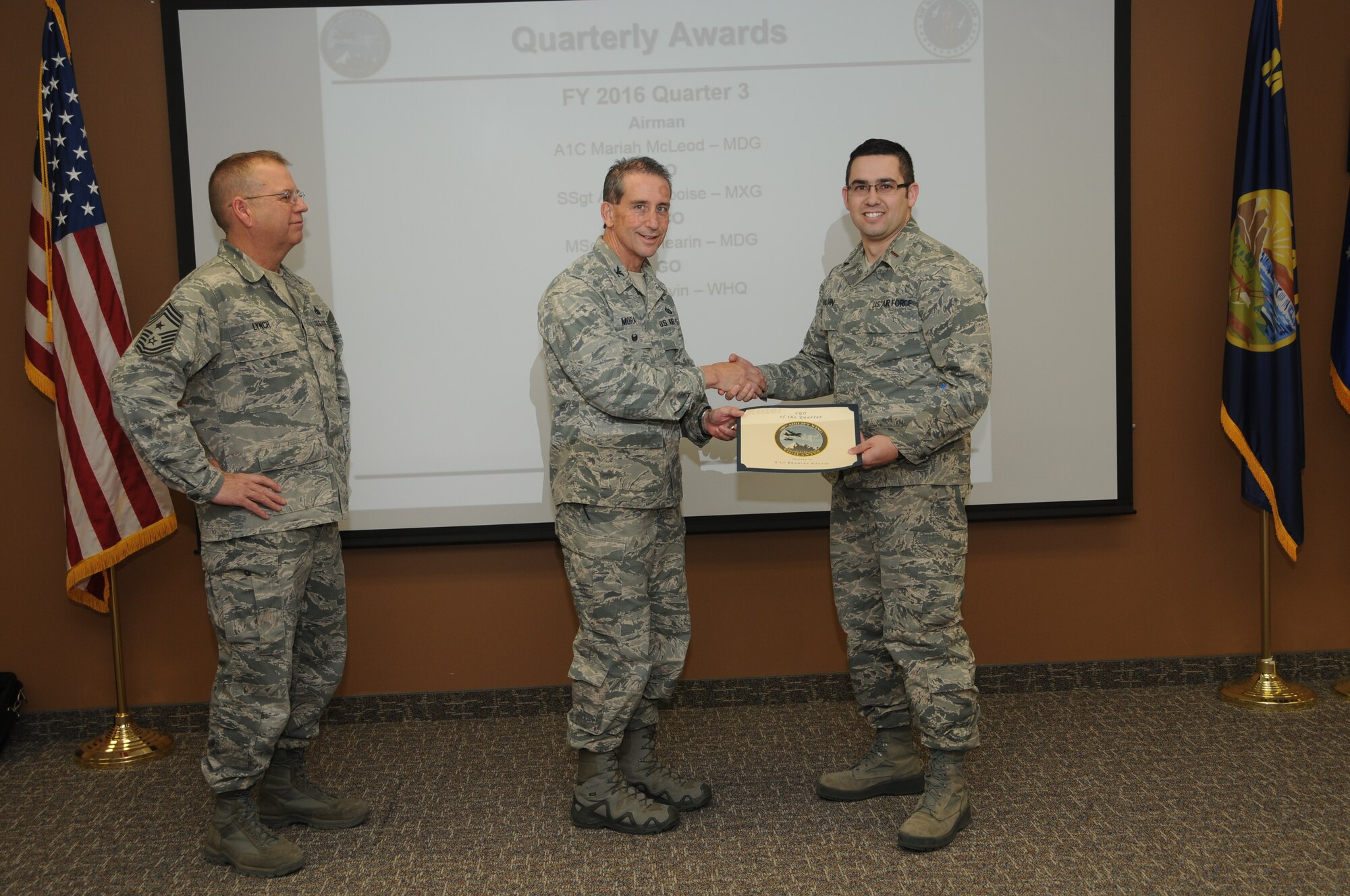 120th Airlift Wing Vice Commander Col. Thomas Mora and 120th AW Command Chief Master Sgt. Steven Lynch presented the Fiscal Year 2016 3rd quarter award winners for the 120th Airlift Wing of the Montana Air National Guard during the Stand-up Briefing held in the Larsen Room of the wing headquarters building Nov. 4, 2016. 120th Wing Headquarters Squadron Budget Officer 2nd Lt. Bradley Gauvin received the Company Grade Officer of the Quarter Award.