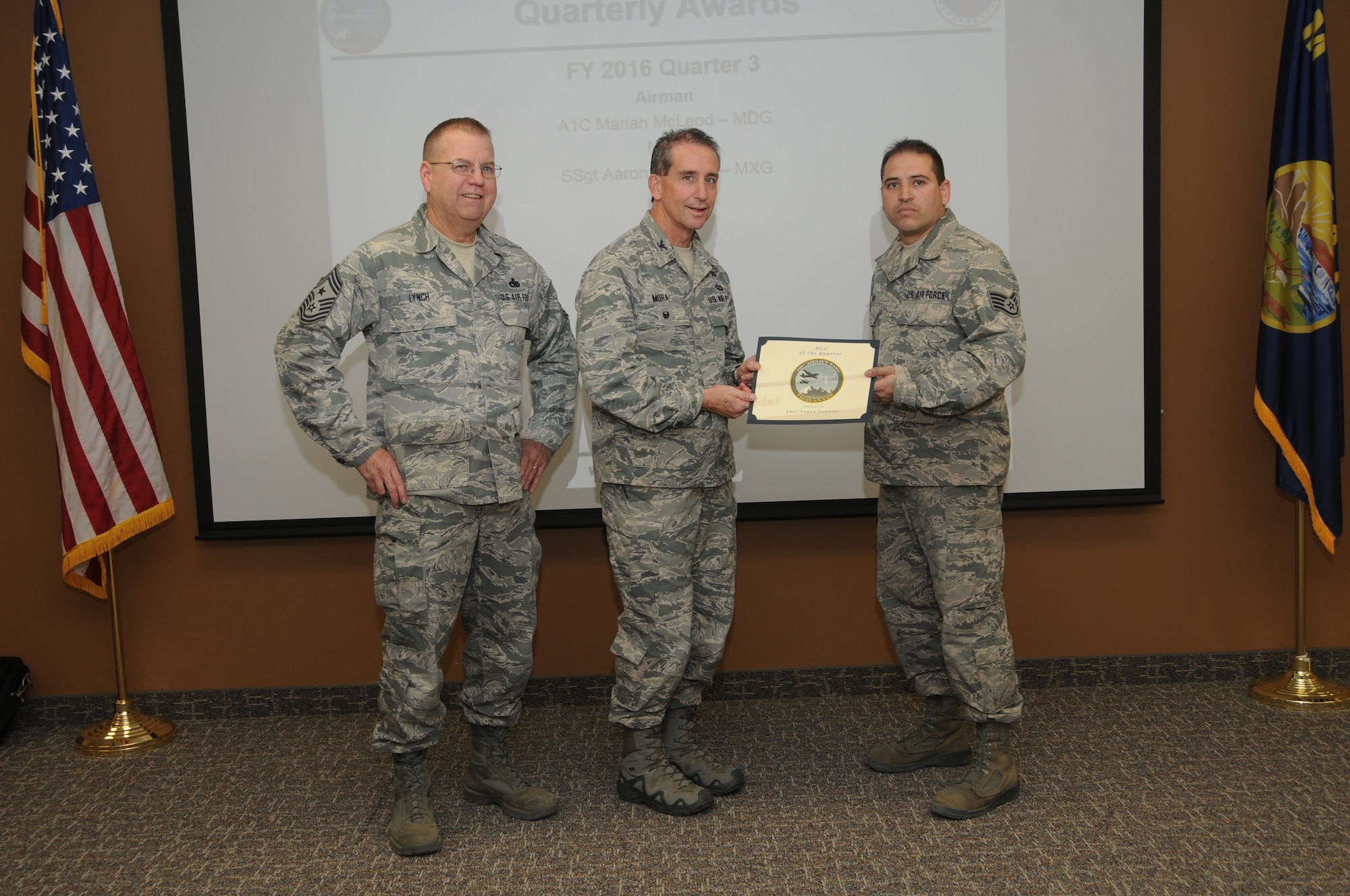 120th Airlift Wing Vice Commander Col. Thomas Mora and 120th AW Command Chief Master Sgt. Steven Lynch presented the Fiscal Year 2016 3rd quarter award winners for the 120th Airlift Wing of the Montana Air National Guard during the Stand-up Briefing held in the Larsen Room of the wing headquarters building Nov. 4, 2016. Aircraft Structural Maintenance Craftsman Staff Sgt. Aaron Duboise from the 120th Maintenance Group received the award in the noncommissioned officer category.