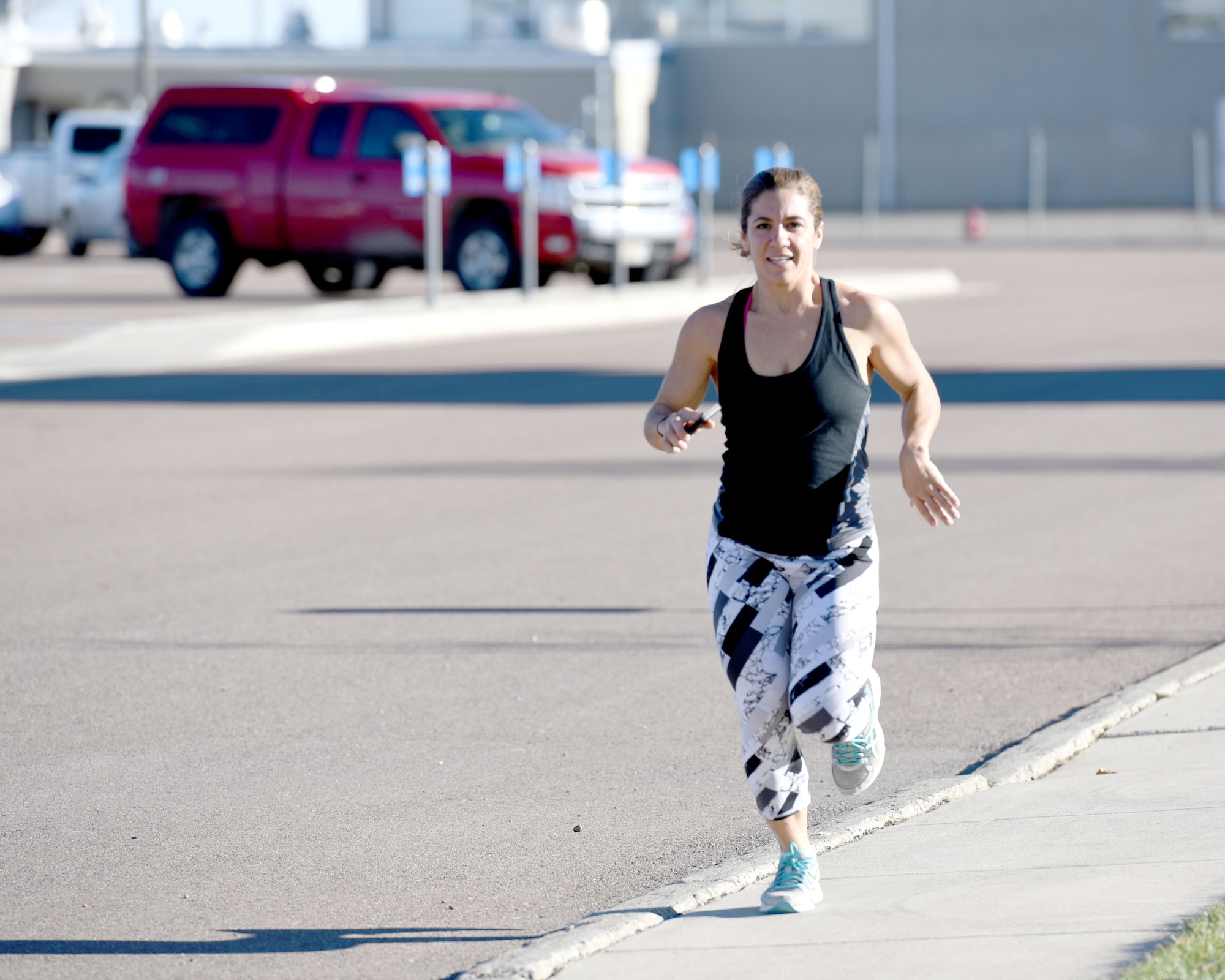 Senior Airman Jacqueline Forsyth completes the final stretch of a two mile run. Forsyth begins each of her fitness improvement classes with a run. (U.S. Air National Guard photo/Tech. Sgt. Michael Touchette)